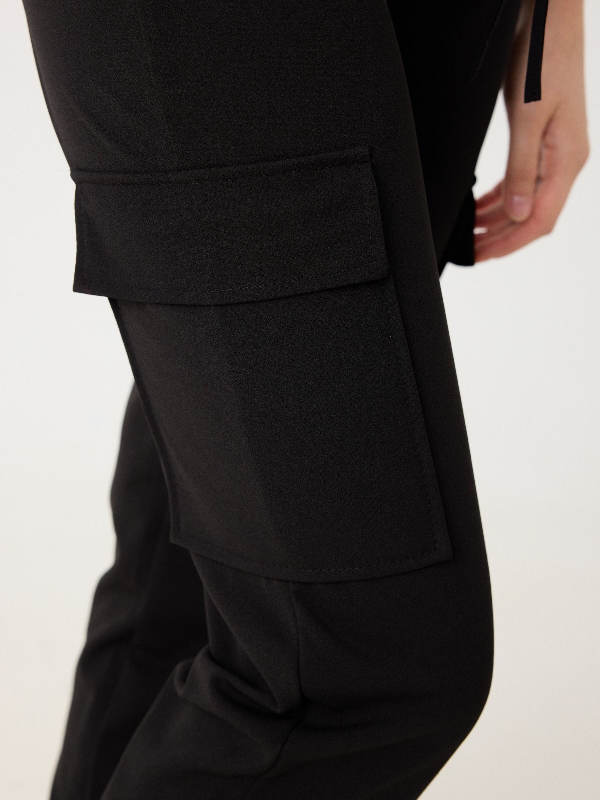 Rubber cargo pants black detail view