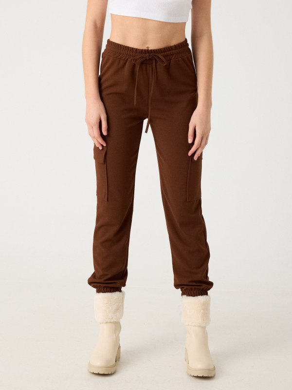 Rubber cargo pants brown middle front view