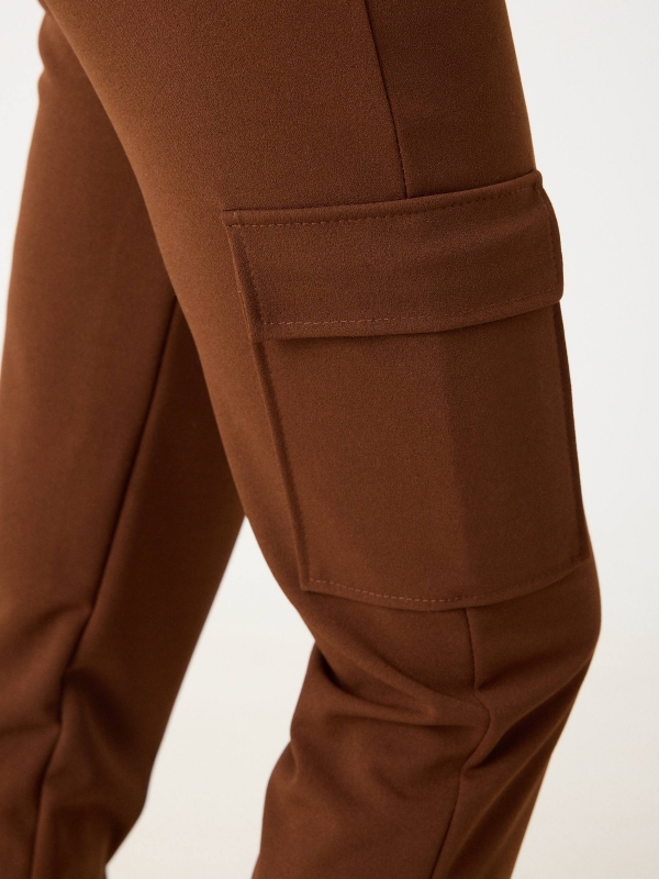 Rubber cargo pants brown detail view