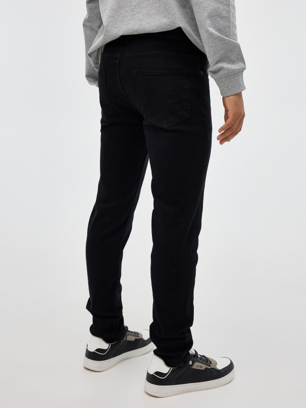 Jeans slim negros negro vista media trasera