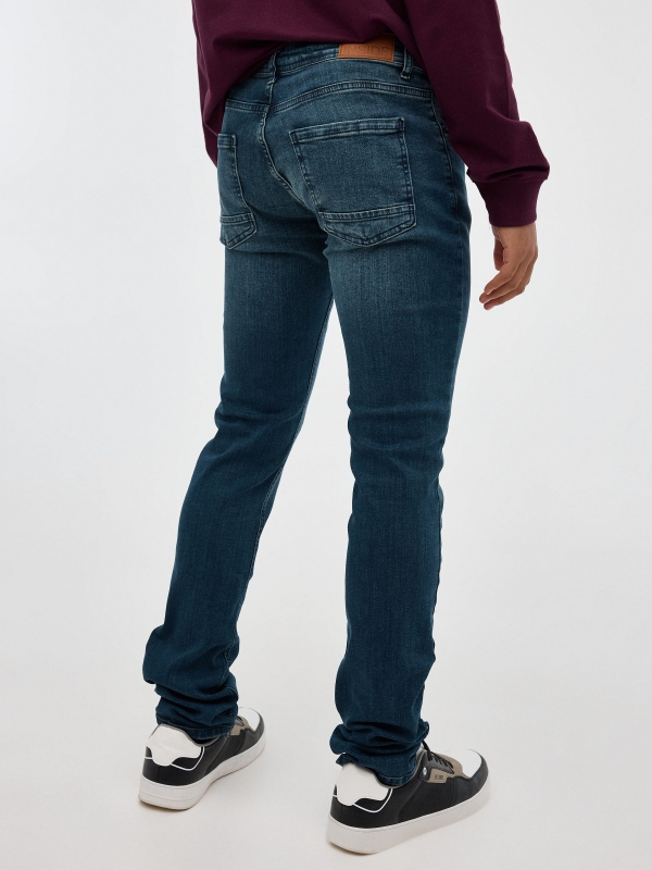 Dark blue slim jeans blue middle back view