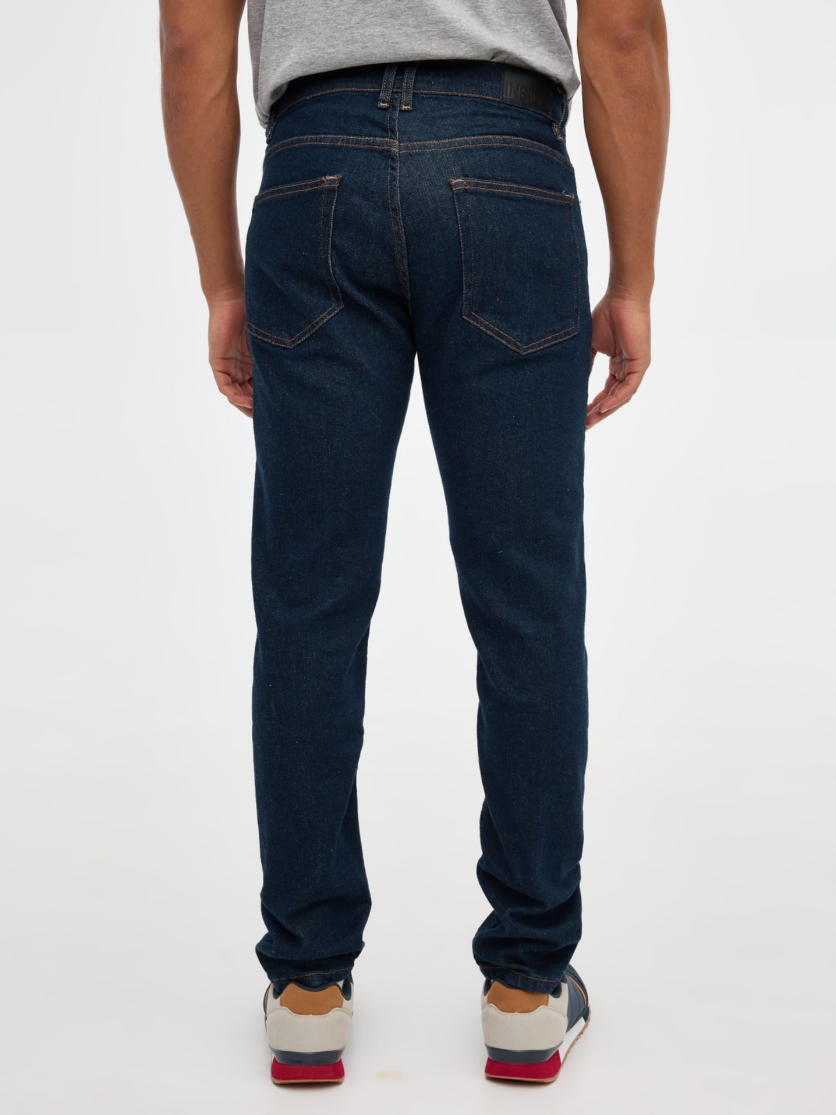 Dark blue slim jeans blue middle back view