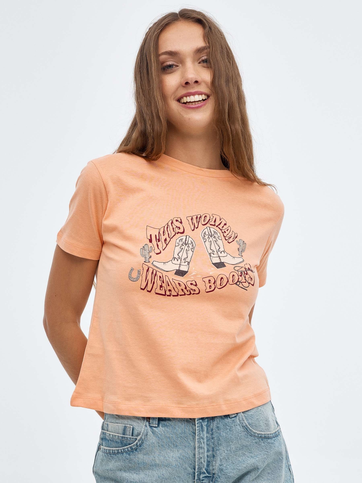 Wears Boots T-shirt peach middle front view