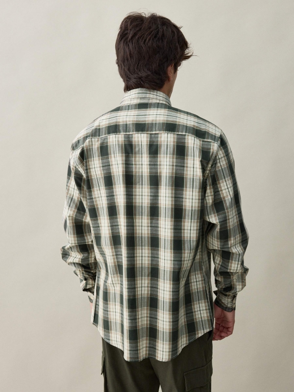 Green checkered shirt beige middle back view