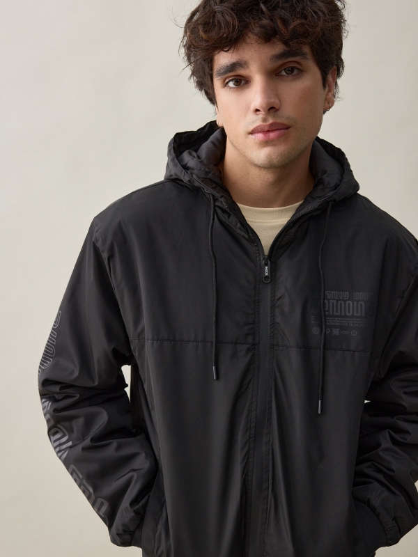 Nylon jacket with hood black detail view