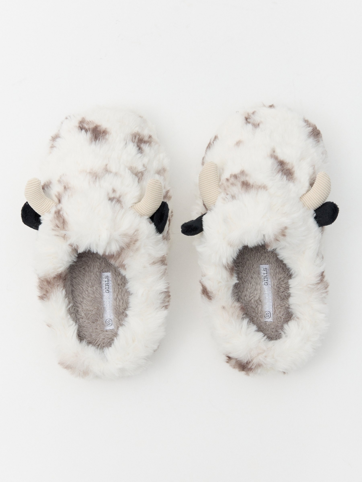 Cow slippers off white detail view