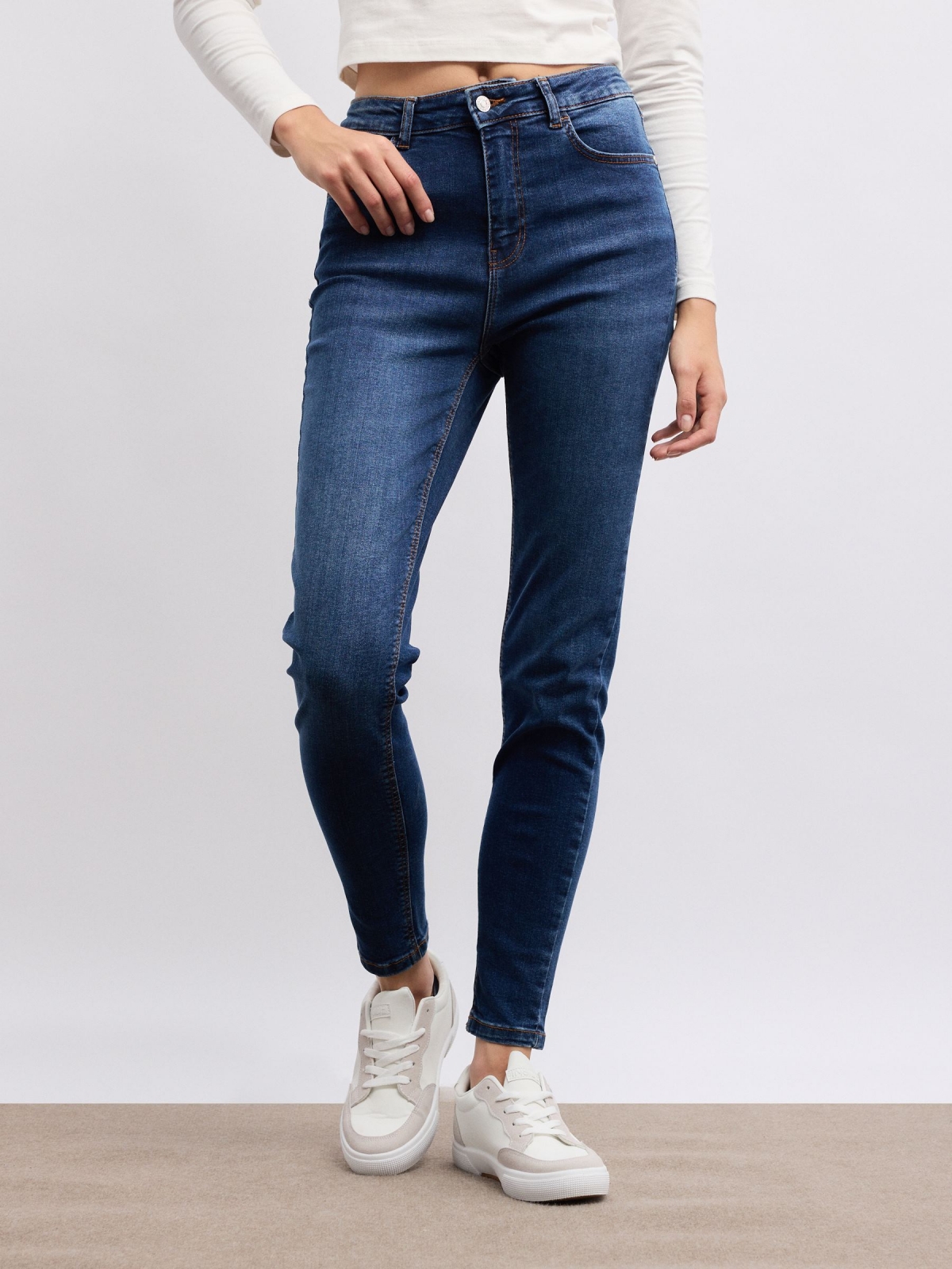 Mid-rise skinny jeans dark blue middle front view