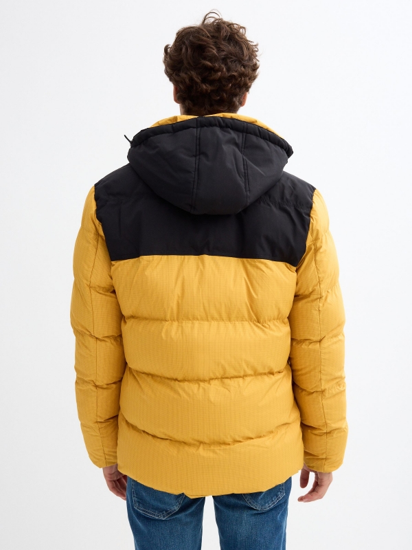 Block color quilted coat yellow middle back view