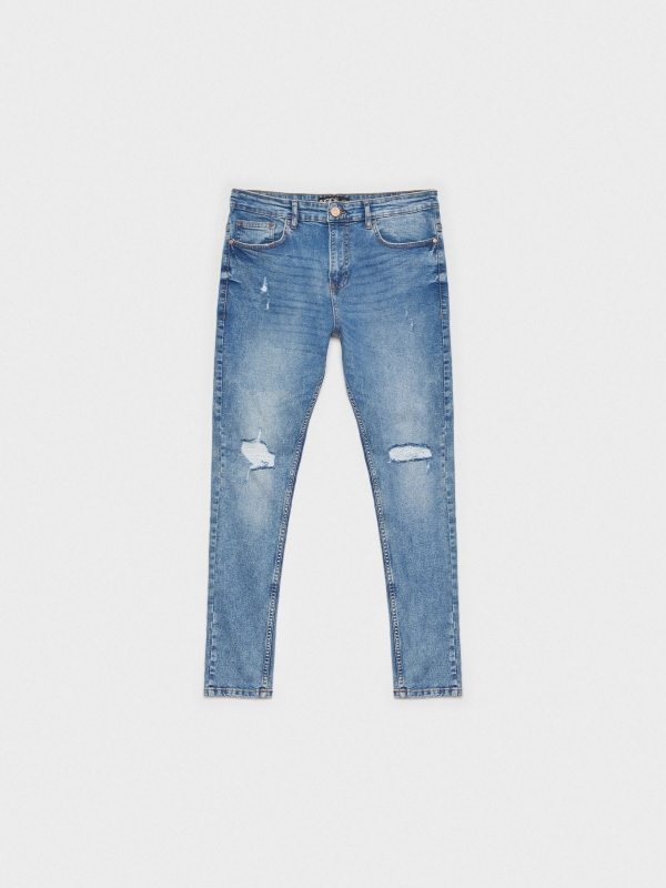 Jeans skinny partes inferiores rasgadas azul vista detalhe