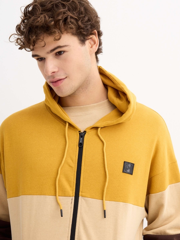 Brown block color hooded sweatshirt ochre detail view