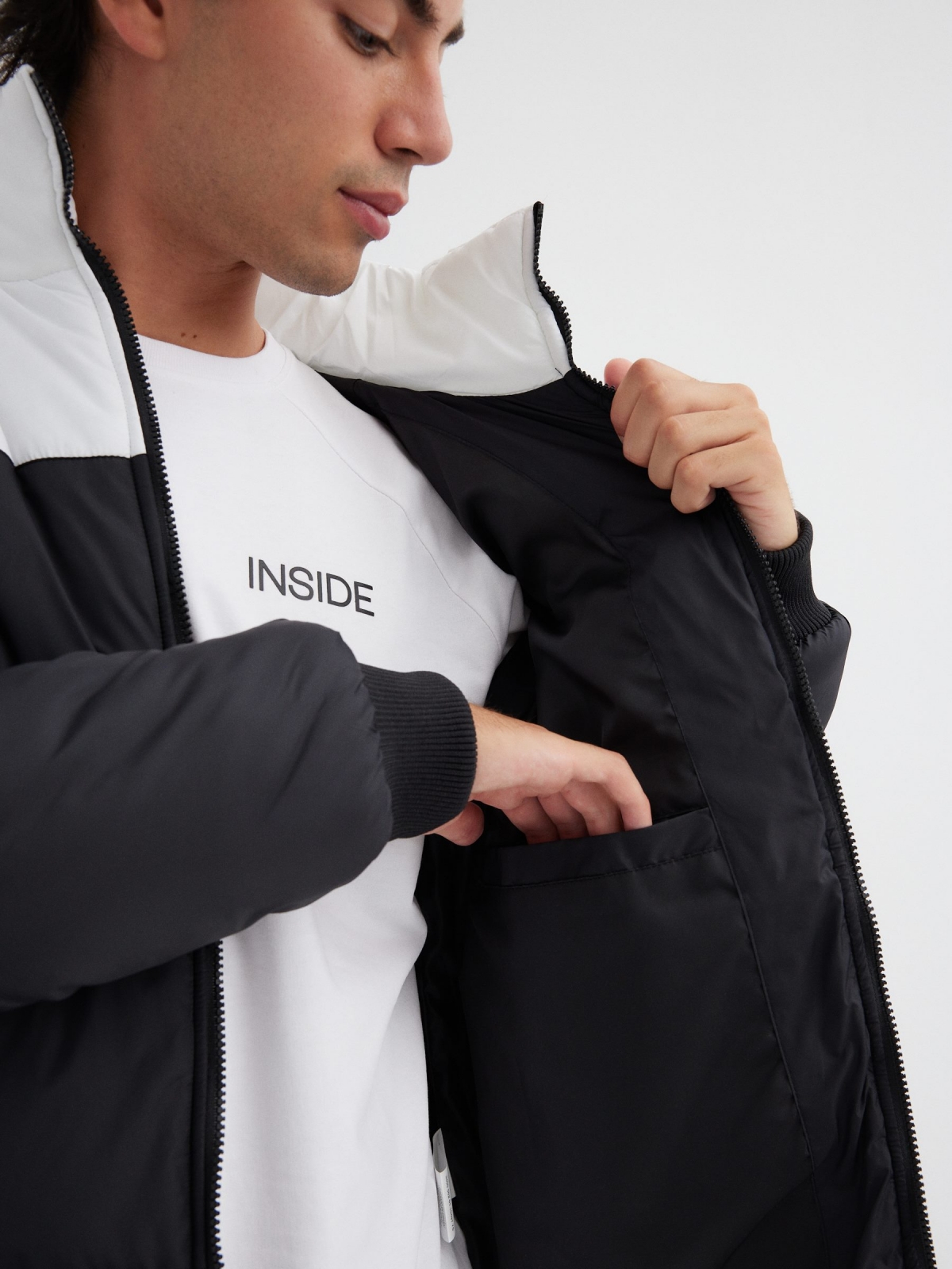 Block color quilted jacket black detail view