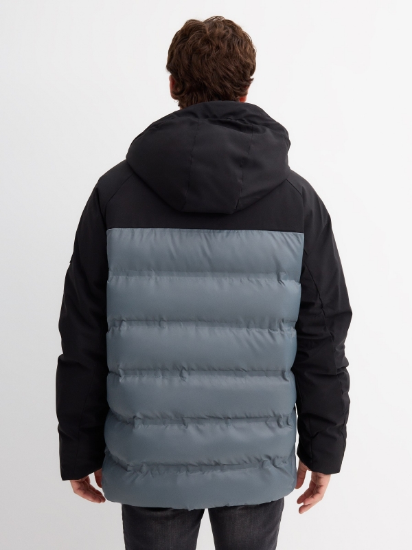 Blue block color quilted coat black middle back view