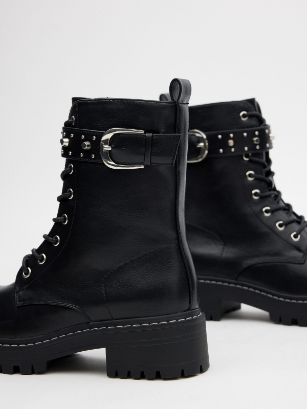 Lace-up boots with buckle and studs black detail view