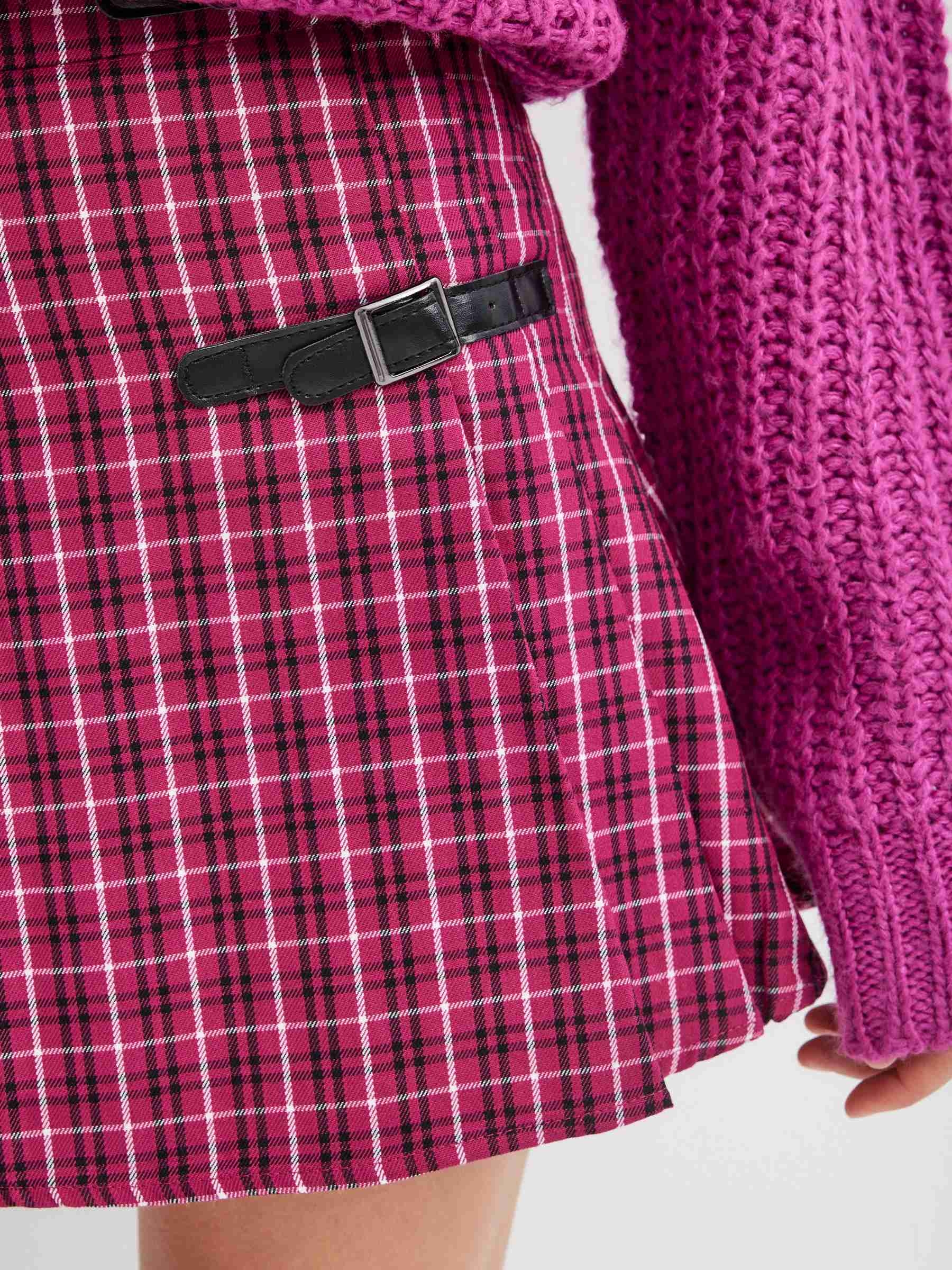 Mini skirt with buckles red middle front view