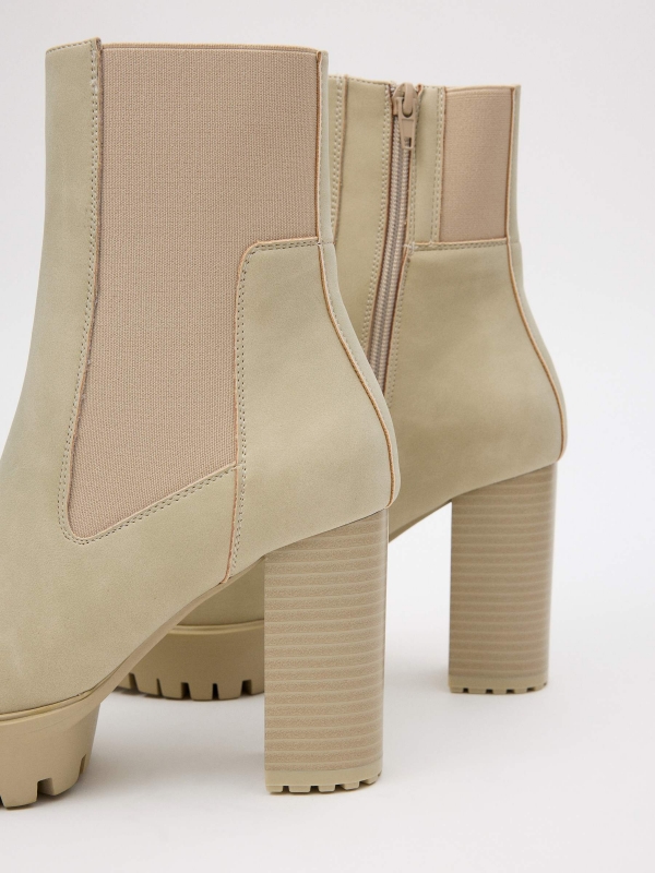 Patent leather ankle boots with elastic beige detail view