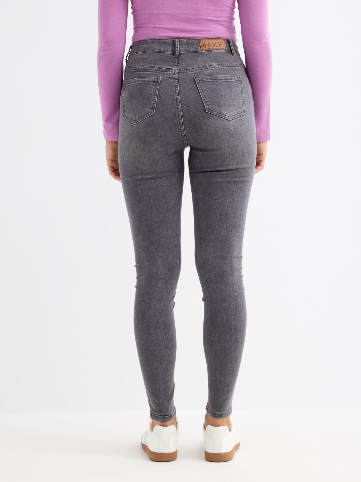 Grey mid-rise jeans light grey middle back view