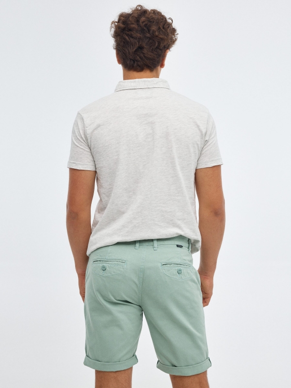 Bermuda shorts with belt green middle back view