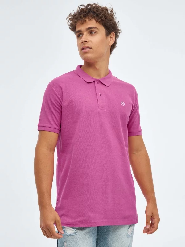 Basic polo shirt with engraved logo fuchsia middle front view