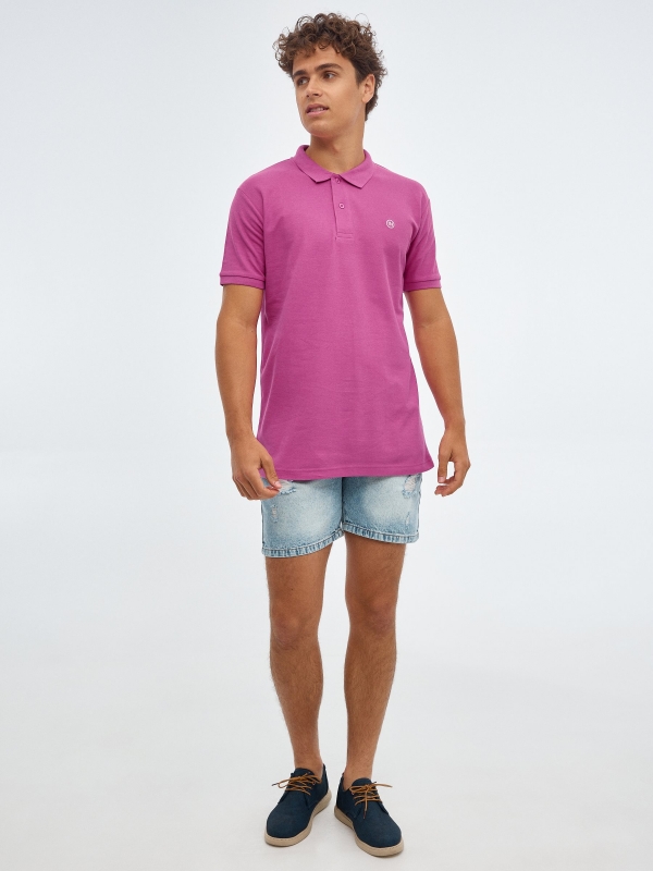 Basic polo shirt with engraved logo fuchsia front view