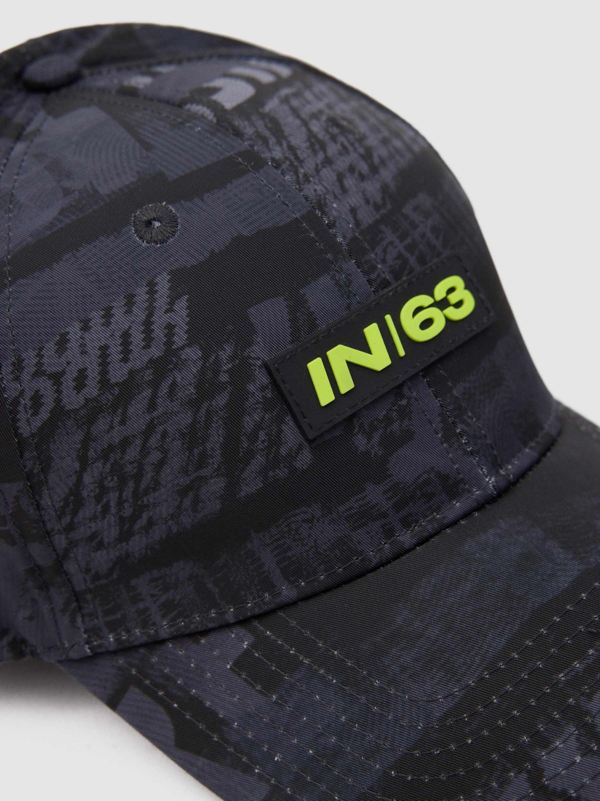 Textured text cap black detail view