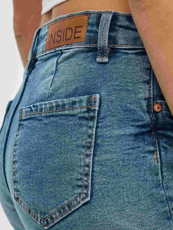 High-waisted denim shorts blue detail view