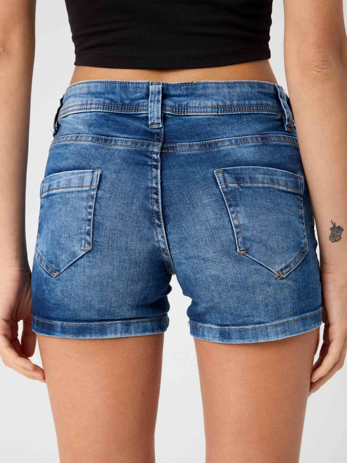 Washed blue low rise denim shorts blue detail view