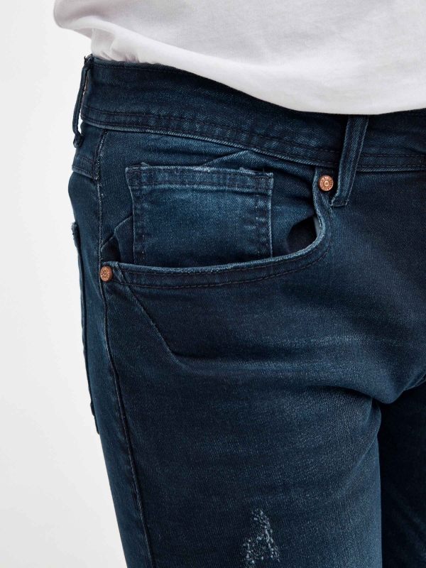 Ripped dark blue denim bermuda short blue detail view