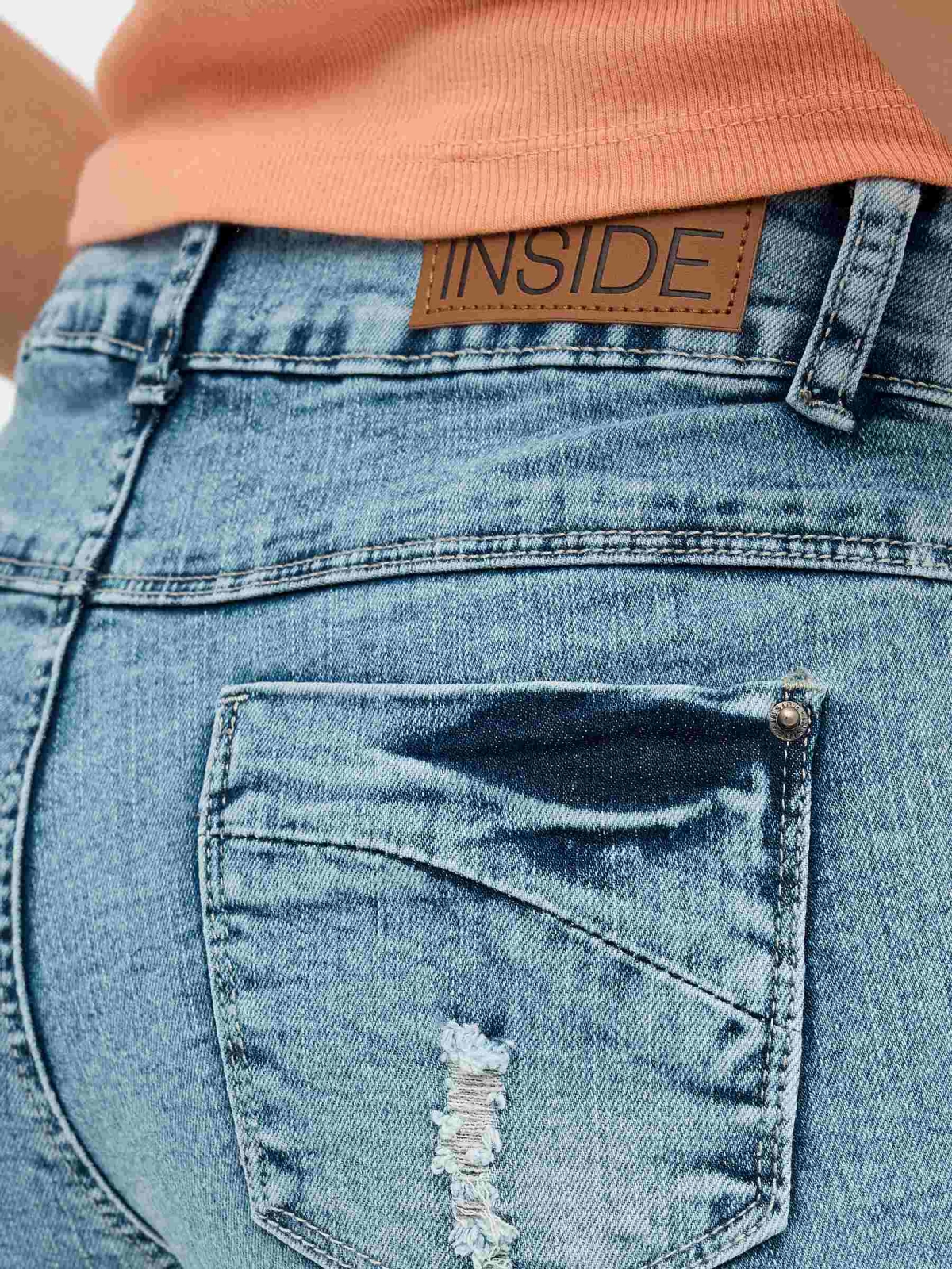 Ripped washed effect denim shorts blue detail view