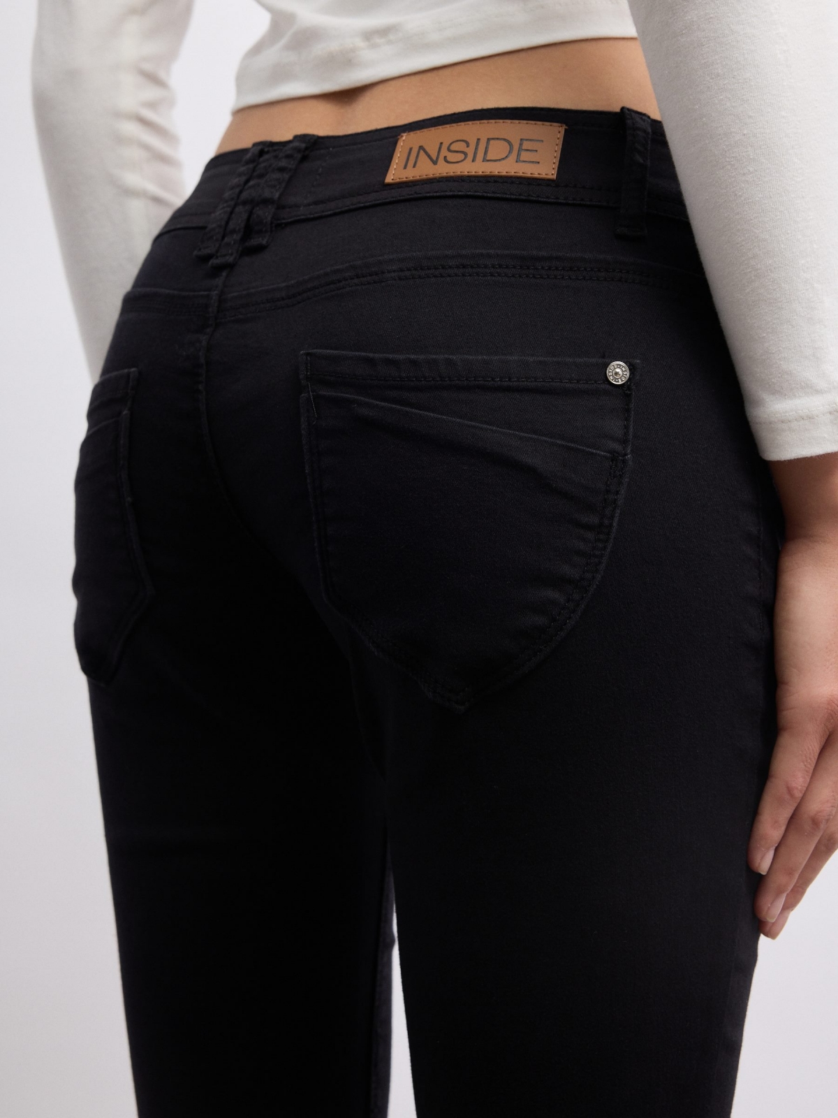 Thigh faint washed double button low-rise skinny jeans black detail view