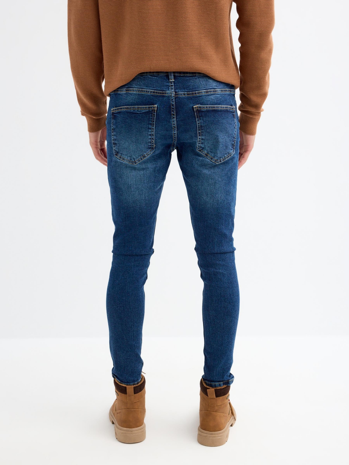 Dark skinny skinny jeans blue middle back view