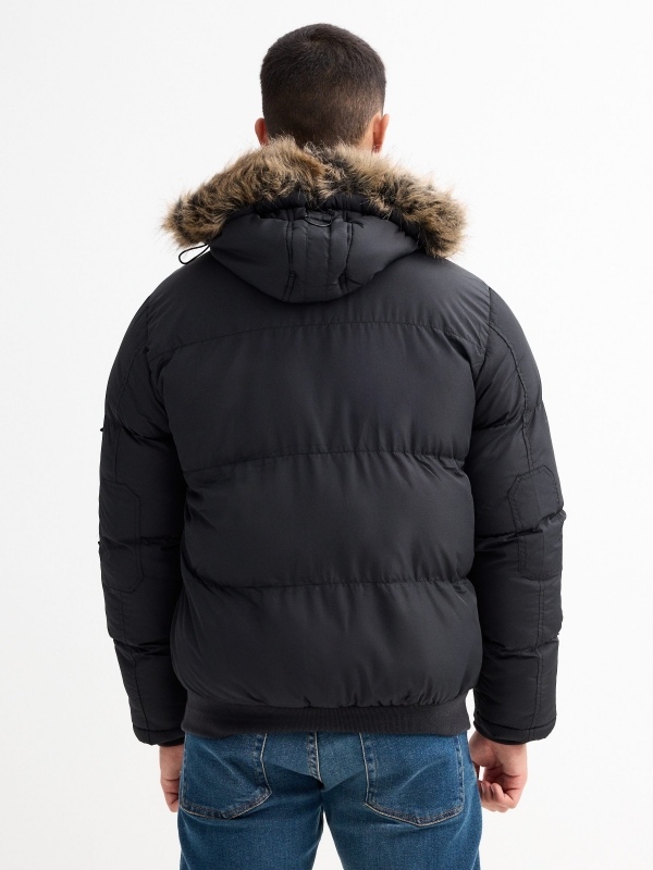 Quilted coat with fur hood black middle back view