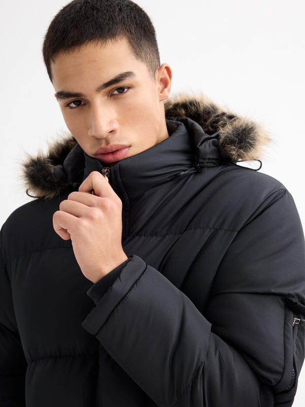 Quilted coat with fur hood black detail view