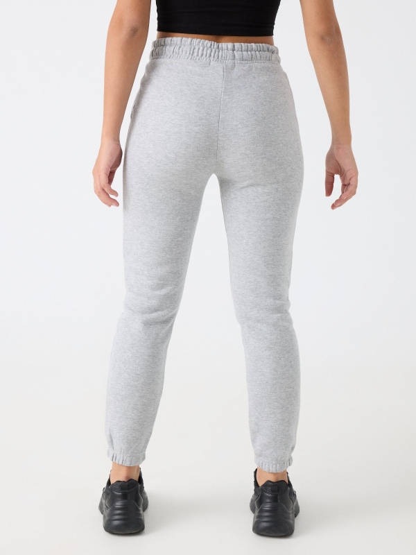 Pantalón jogger felpa gris melange vista media trasera