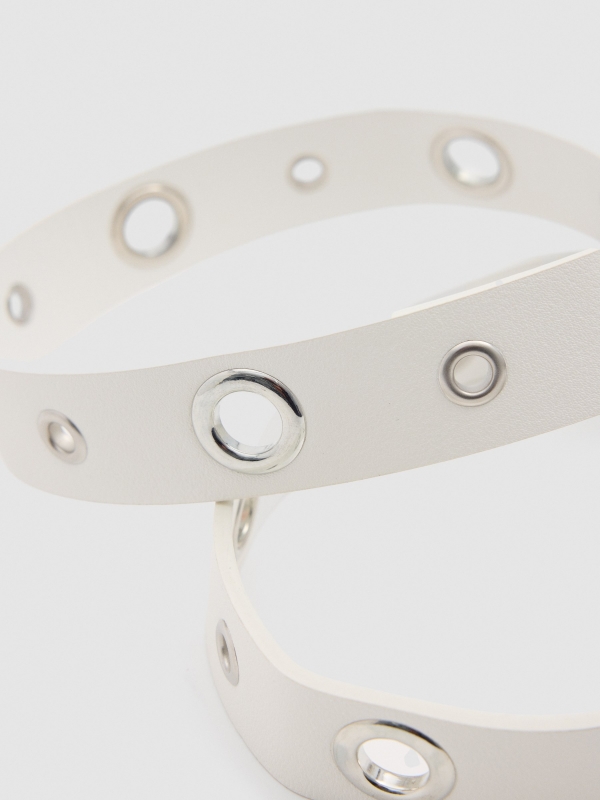 White leatherette belt with eyelets and round buckle beige detail view