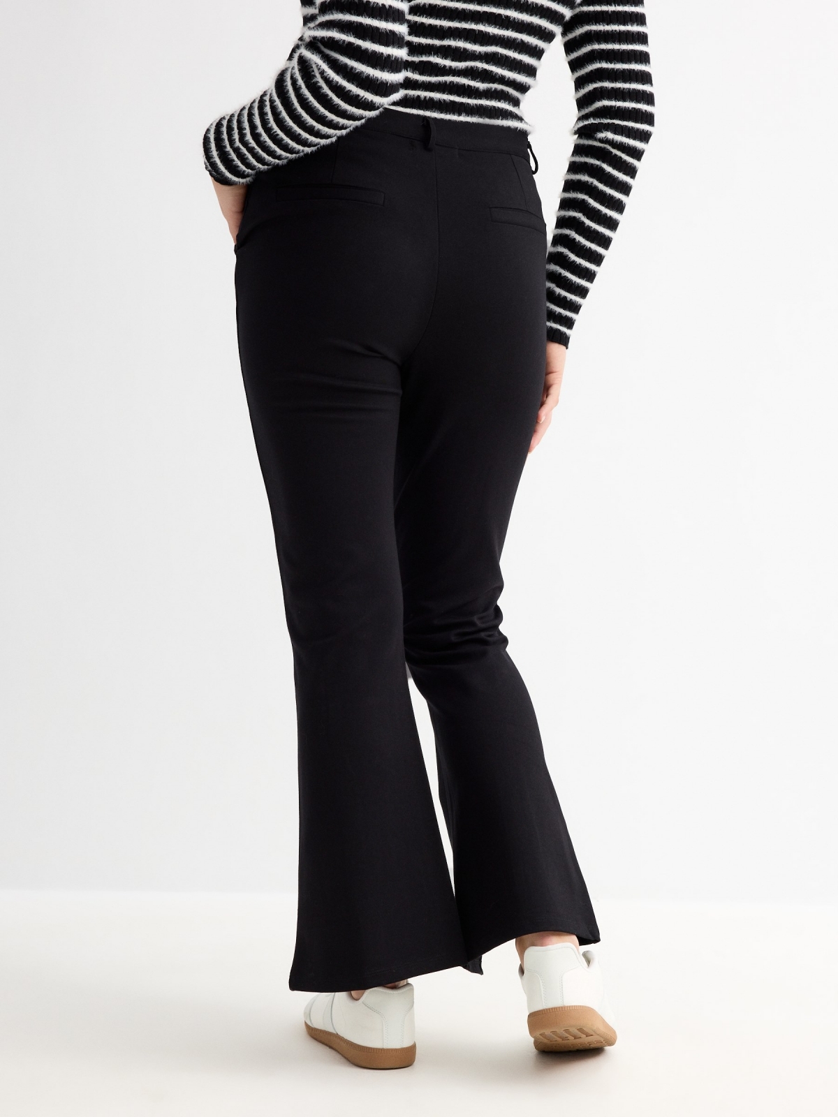 Flared dress pants with opening black middle back view