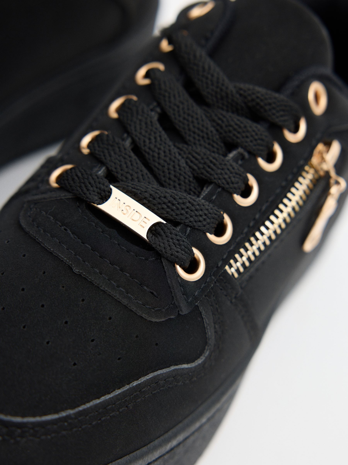 Modern platform sneakers black detail view