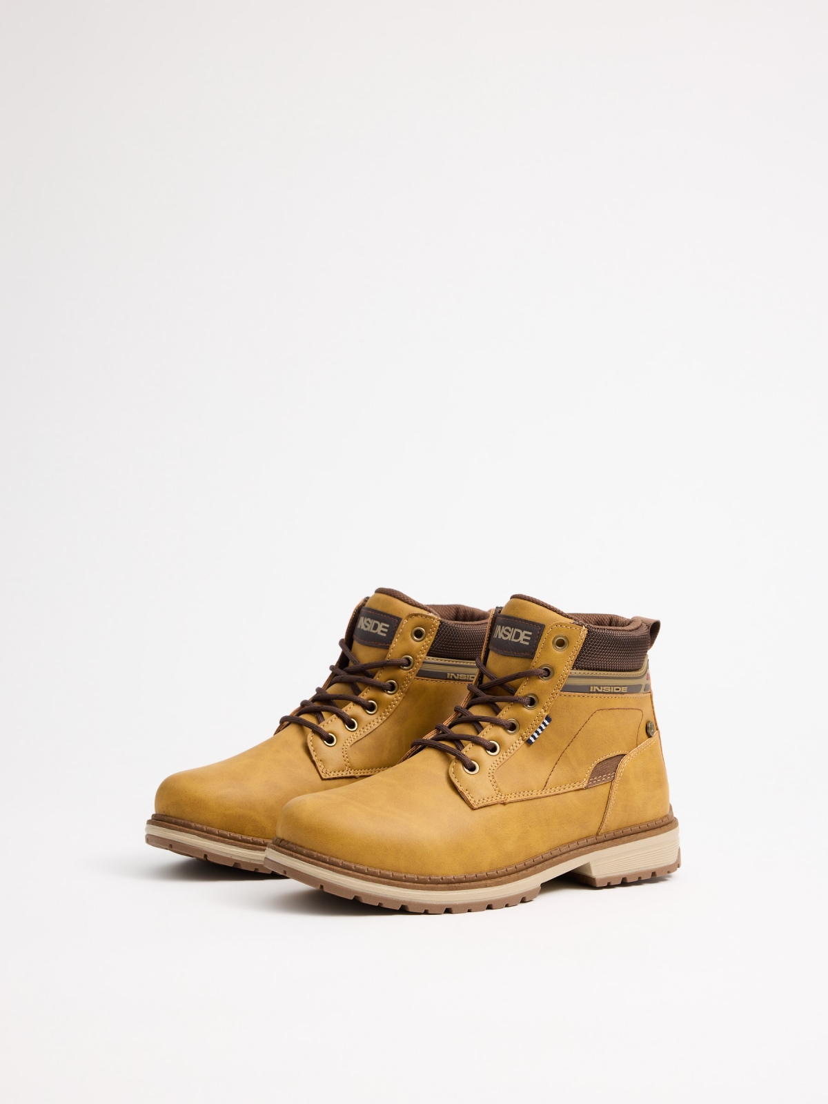 Mustard mountaineering boot with track sole yellow 45º front view