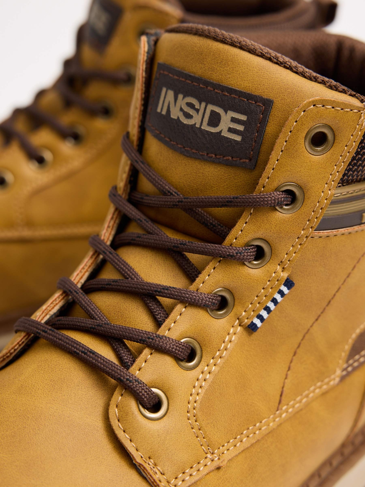 Mustard mountaineering boot with track sole yellow detail view