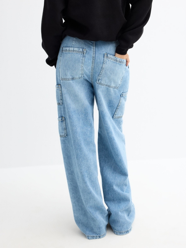 Wide leg carpenter blue jeans light blue middle back view