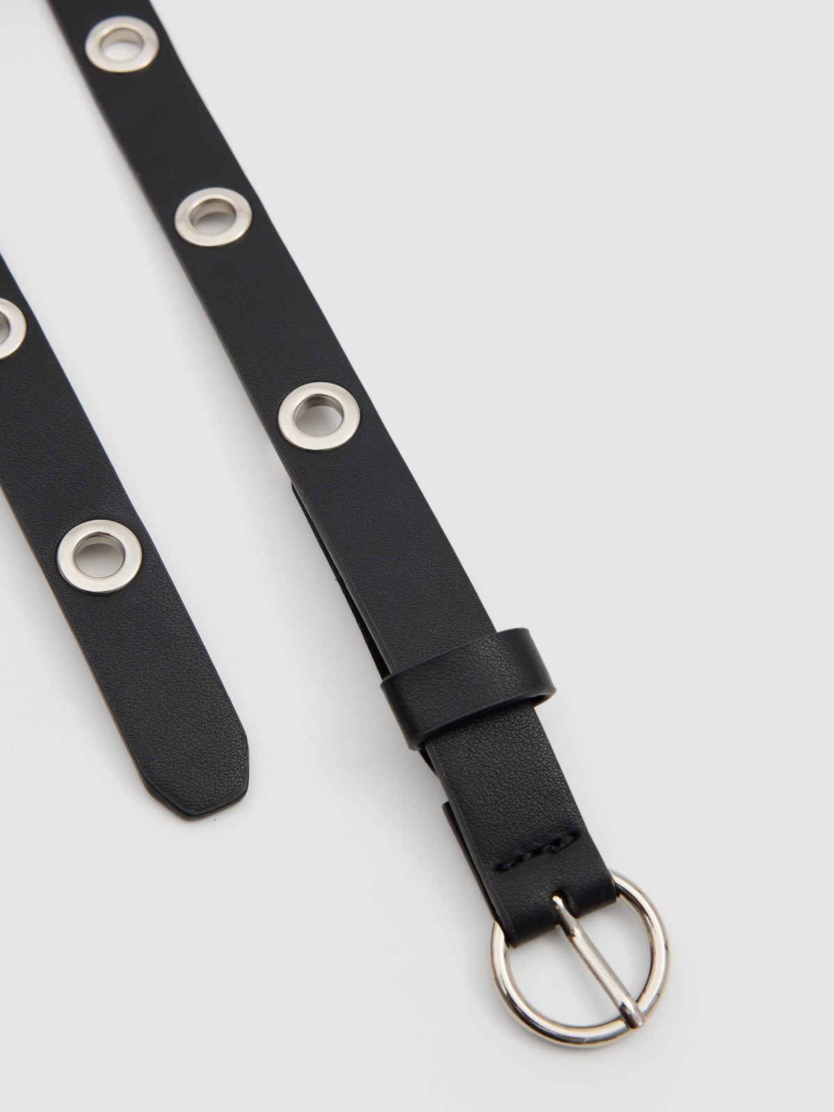 Thin belt with perforated outline. black buckle