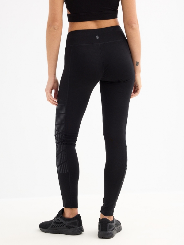 Thin striped leggings black middle back view