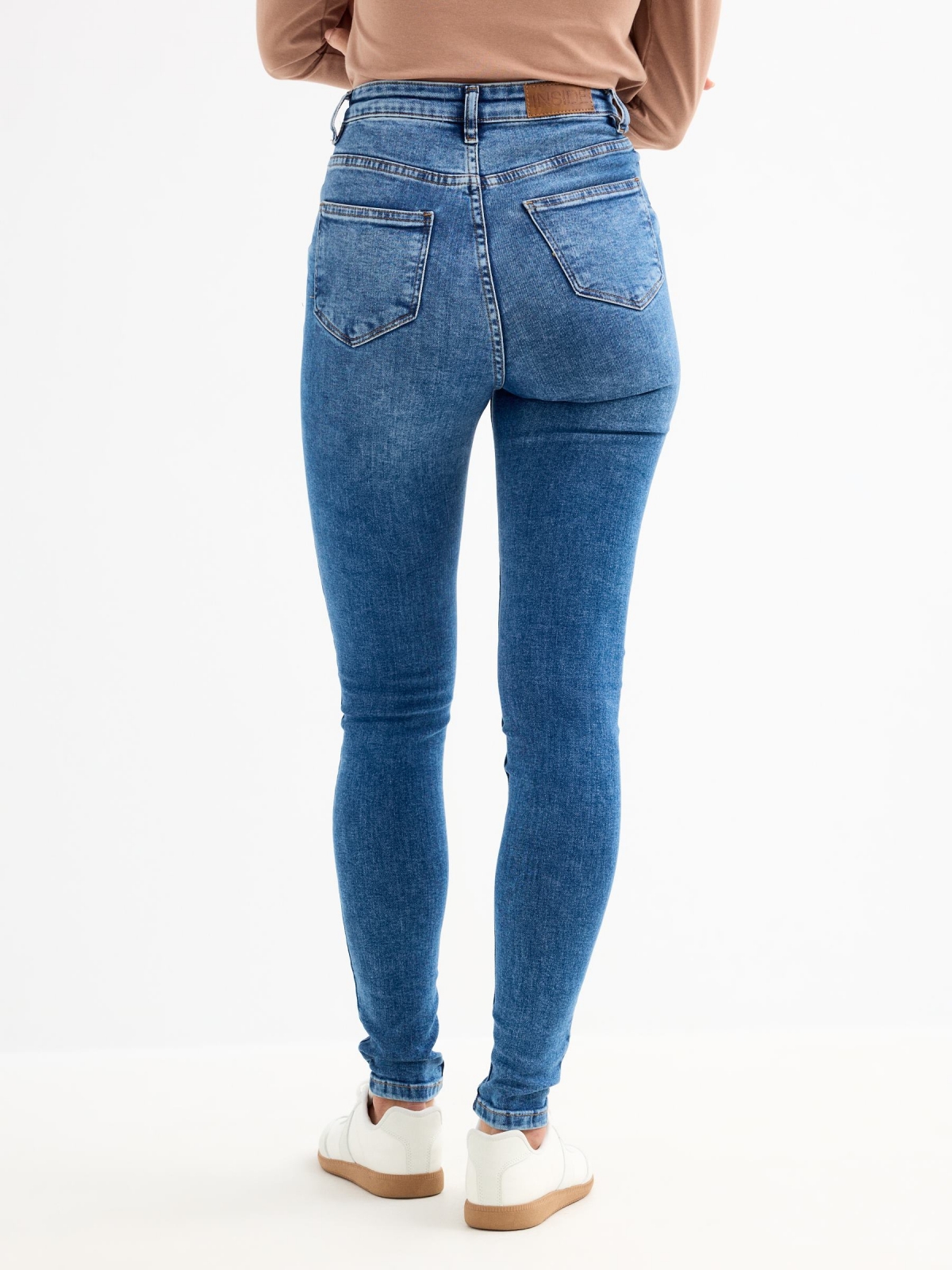 High rise skinny jeans blue middle back view