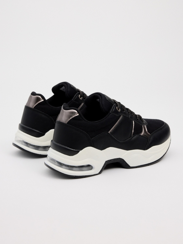 Air chamber volume sole sneaker black 45º back view