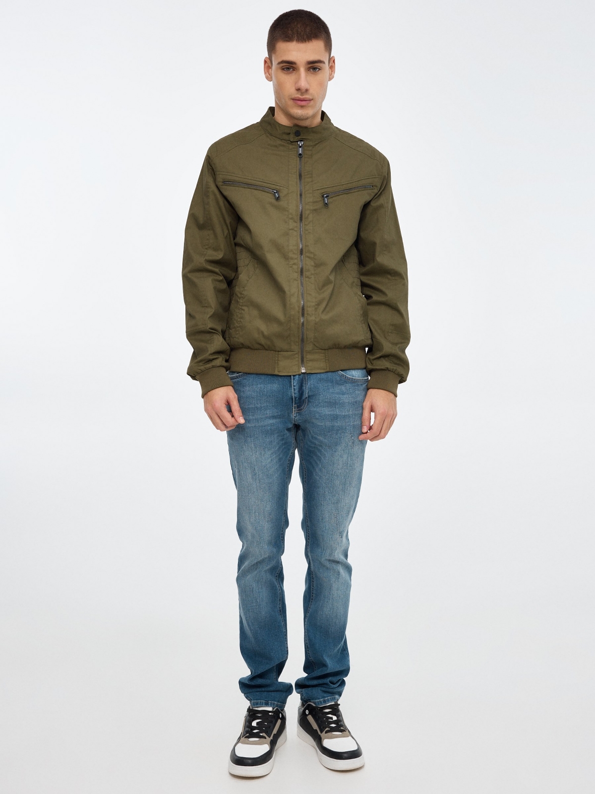 Black nylon jacket green front view