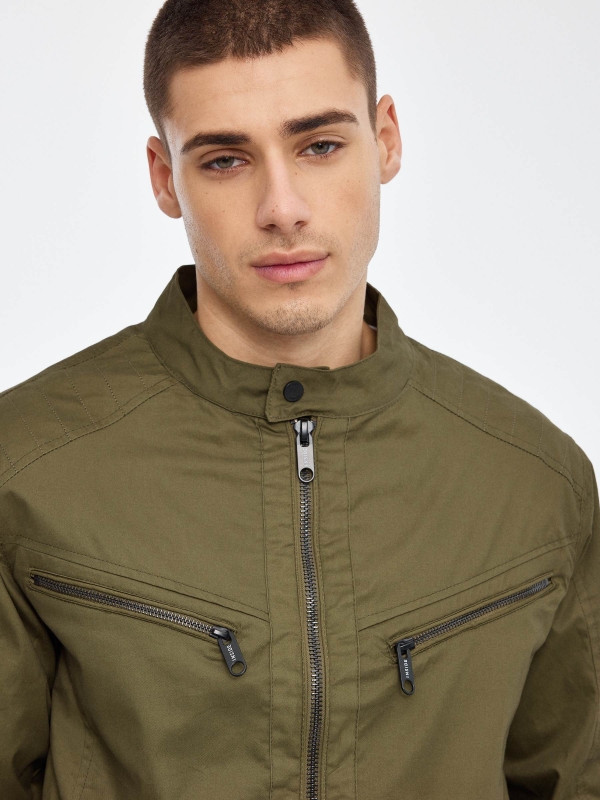 Black nylon jacket green detail view