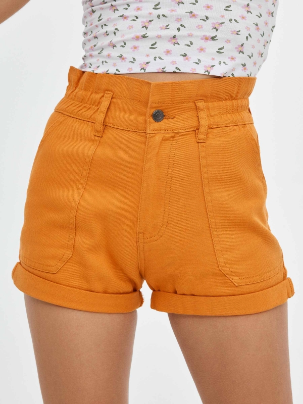 Coloured baggy  shorts ochre detail view