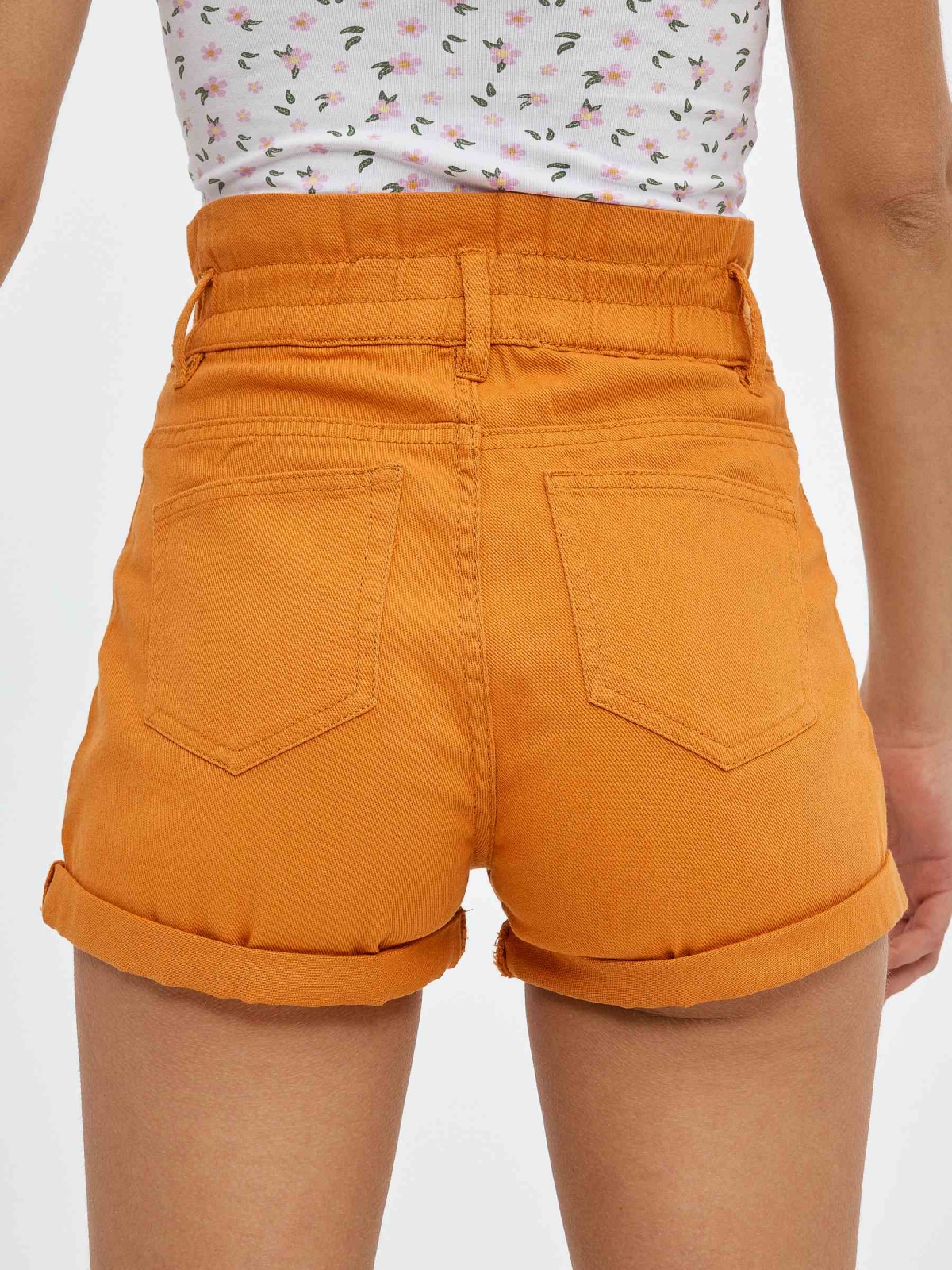 Coloured baggy  shorts ochre detail view