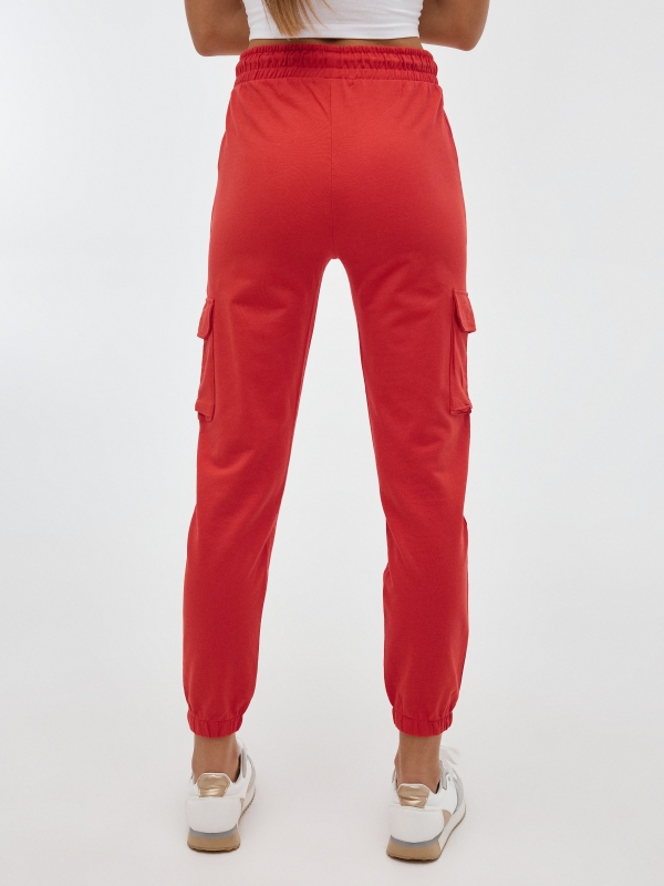 Pantalón jogger felpa naranja vista media trasera