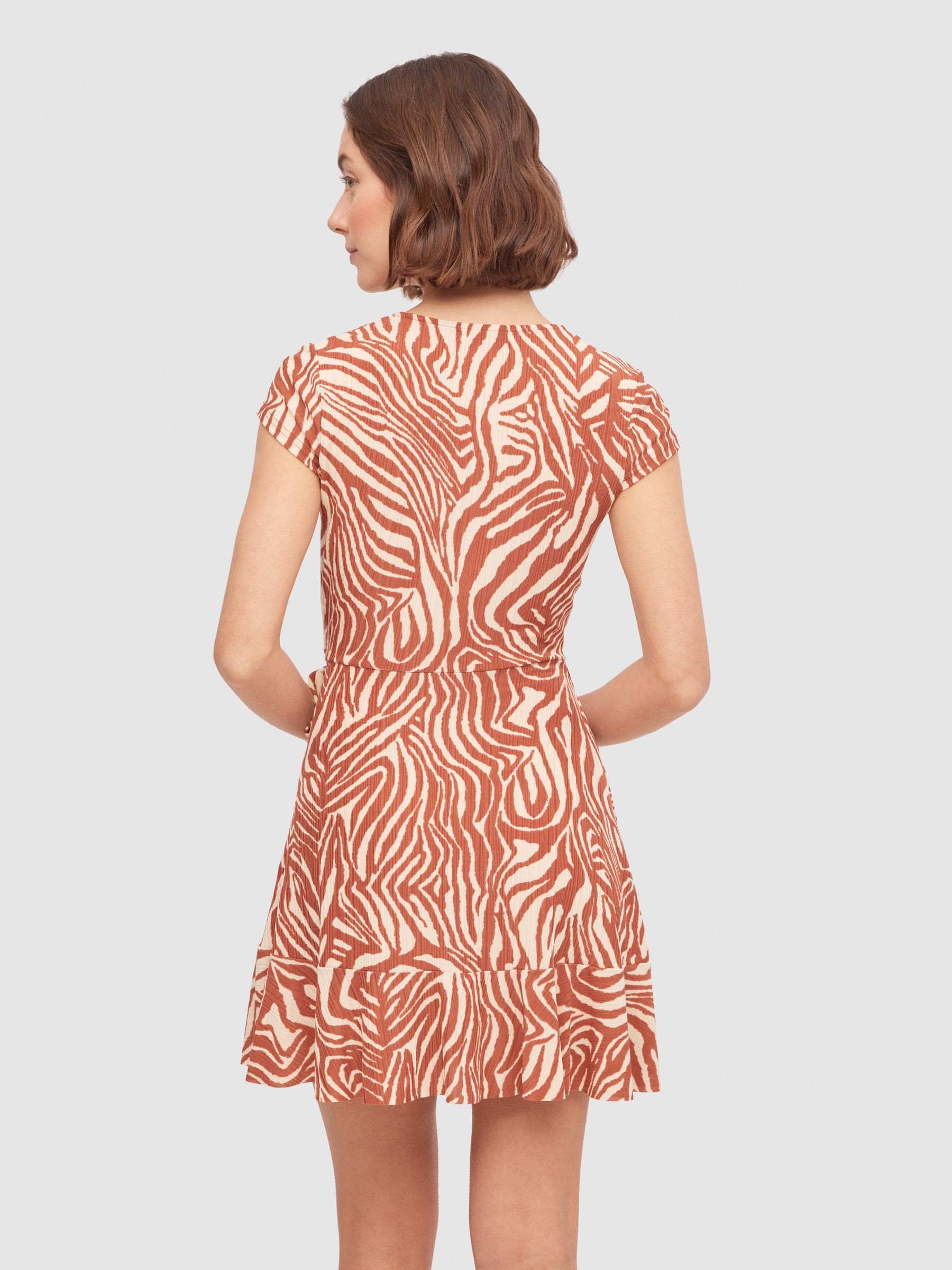 Tiger crossover neckline mini dress sand middle back view