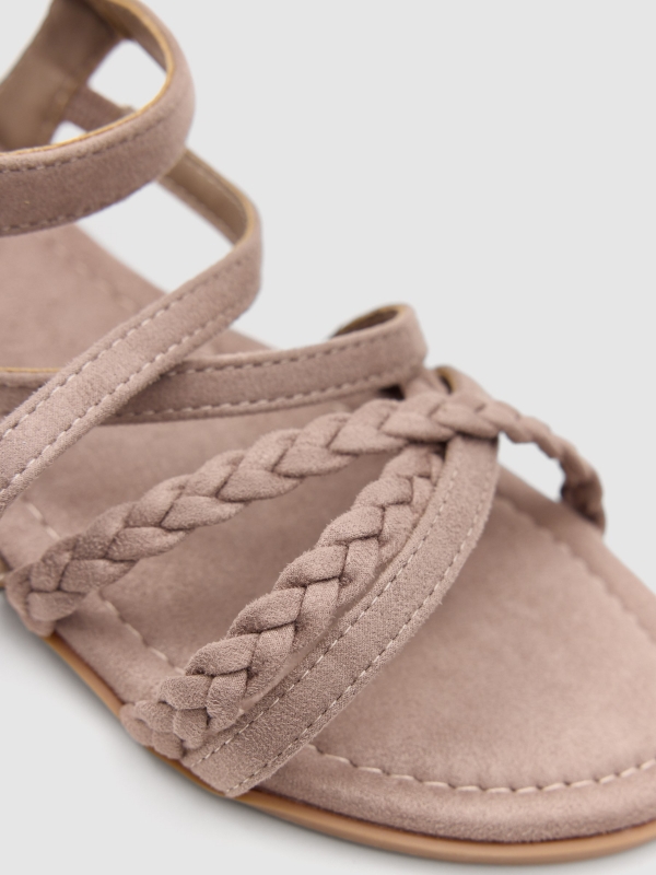 Braided straps sandal sand detail view